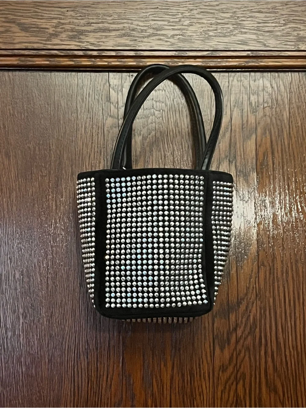 Fun and funky black and silver studded bucket bag. 80s and 90s studio 51 vibes!